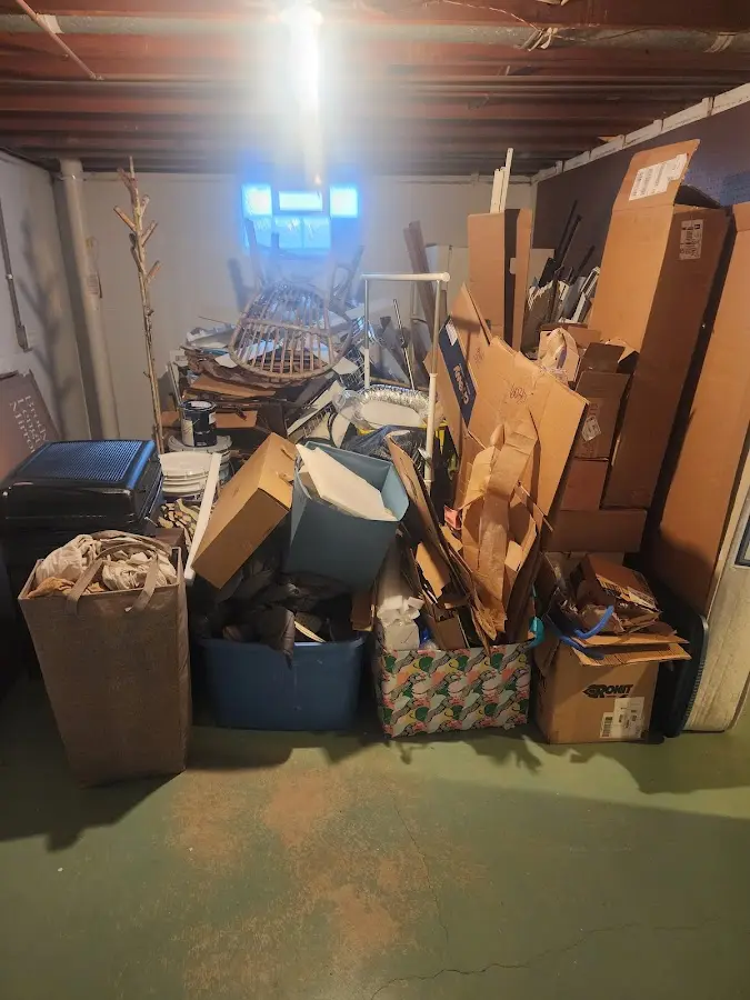 Roll-off dumpster container at job site for 4 Yard Dumpster Rental in Wolverine Lake